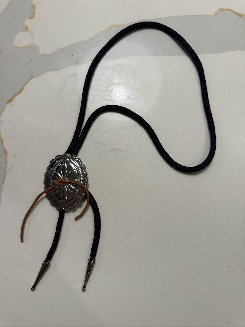 Black and Silver Bolo Tie with Concho Accent